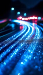 Wall Mural - blue illuminated highway with moving car headlights at night