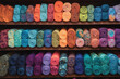 © Midea  - Shelf full of colorful yarns, neatly arranged by colors and textures, ready for crafting projects.