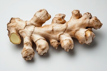 Wall Mural - Fresh raw ginger root on white background for cooking and health applications