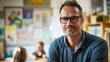 © Daiki - A confident male teacher in his forties stands in a vibrant classroom, smiling warmly. This portrait highlights a supportive and engaging educator in action.