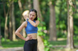 © crizzystudio - Young asian woman wearing sportswear and smartwatch feeling a muscle pain in her shoulder during outdoor workout in a park, massaging her arm
