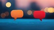 © OngCaLucK - Two colorful speech bubbles in orange and red against a blurred background, symbolizing communication and conversation.