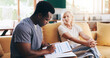 © peopleimages.com - Woman, caregiver and writing on documents for checkup procedure, medical questions and healthcare survey. Mature patient, volunteer and paperwork for symptoms, diagnosis report and treatment at house