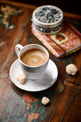 Wall Mural - Cup of coffee on wooden background. Soft focus. Copy space