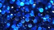 © Tom - A close-up of shimmering blue beads with varying intensities of light creating a vibrant and captivating effect.