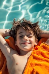 Wall Mural - a young boy with messy hair is lying on his back, smiling with eyes closed in the sun at summer camp