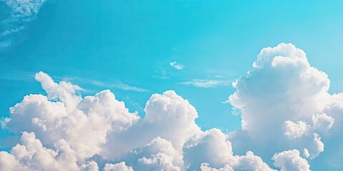 Aufkleber - Bright blue sky with soft fluffy white clouds scattered across the upper half, creating a serene and peaceful atmosphere during daytime.