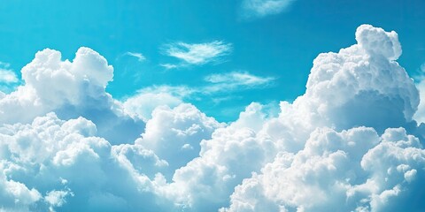 Aufkleber - Fluffy white cumulus clouds dominate the upper two-thirds of a bright turquoise sky with subtle wispy clouds in the background, creating a serene atmosphere.