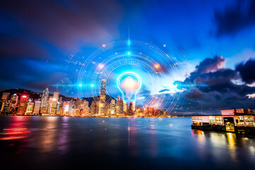 Fototapete - Vibrant Hong Kong cityscape at night, reflecting city lights on the water. A futuristic glow surrounds the skyline, creating a dynamic urban scene.