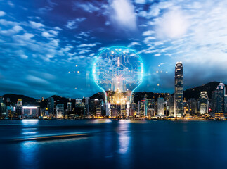Fototapete - Hong Kong skyline at night featuring a glowing digital light bulb shape filled with network connections above the cityscape and harbor with city lights.