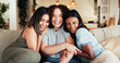 © peopleimages.com - Women, friends and hug with smile on sofa for gossip, social bonding or together at home. Female people, group and embrace with love for friendship, friendly advice or chatting on couch at house