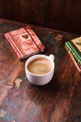 Wall Mural - Cup of coffee on wooden background. Soft focus. Copy space