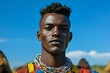 © Jay - Portrait of a young African man with his tribe in the background, wearing traditional and jewelry, Generative AI