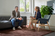 © Lomb - Middle-aged man discussing personal issues with a therapist during a counseling session
