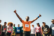 © Jacob Lund - Runner celebrating victory with crowd at marathon finish line