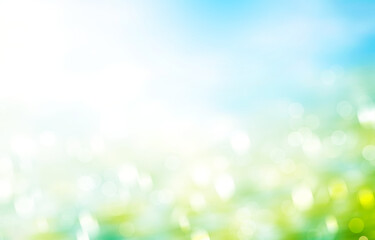 Wall Mural - green grass blue sky blurred background stock photo. rainbow blur easter background wallpaper stock 