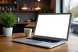 © Kanya - Laptop with blank screen on wooden table in modern cafe , cafe, screen