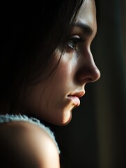 Poster - Woman gazing thoughtfully out of a window in soft natural light during late afternoon. Generative AI