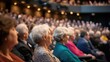 © Satisgitfied - Engaged Audience Attentively Listening to a Presentation in Theater