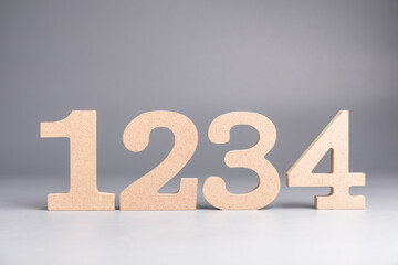 Poster - 1,2.3,4 wooden numbers set on gray background, step-by-step process