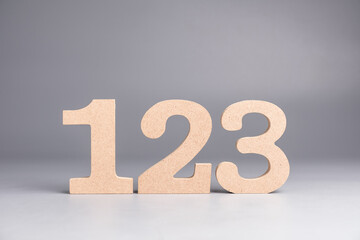 Poster - 1,2.3, wooden numbers set on gray background, step-by-step process