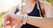 © peopleimages.com - Exercise, hands and woman check smart watch outdoor for performance tracking, speed monitor and training results. Runner, athlete and sports app for fitness progress, heart rate and calories count