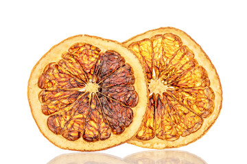 Wall Mural - Several slices of dried grapefruit, close-up, isolated on a white background.