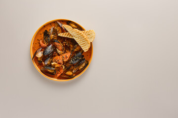 Sticker - Mussels in Tom Yum Sauce - Minimalist Photography with Warm Tones and Subtle Lighting