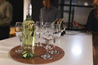 © Wavebreak Media - Wine bottle and glasses on table during business networking event at office