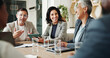 © peopleimages.com - Happy, corporate and business people in meeting with manager for feedback, strategy and project. Office, teamwork and men and women with documents and tech for collaboration, planning and proposal