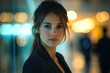 © Odin AI - Captivating portrait of a young woman in a modern urban setting during evening hours