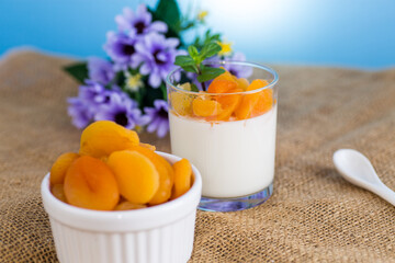 Wall Mural - Light fruit yogurt with dried apricots and mint