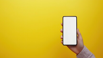 hand holding smart phone with blank white screen. Background solid yellow
