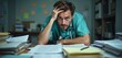© Vadym - Photo of health worker overwhelmed by work. Stressed doctor with stethoscope sits at desk with papers. Tired medical pro overworked, suffers headache. Burnout. Mental health problems in healthcare