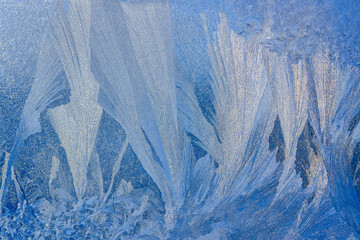 Beautiful ice patterns on the glass. Original background for New Year's design