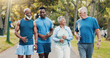© peopleimages.com - People, talking and walking for fitness outdoor with mobility training, discussion and morning routine. Senior, community and coach of conversation, exercise and motivation for cardio workout at park