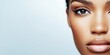 © vejaa - Beauty portrait of African American woman on neutral blue background. Cosmetology , skin care, facial treatment and makeup