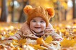 © Matvejs - Charming toddler in red coat joyfully enjoying autumn in a leafy park   capturing childhood moments