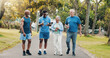 © peopleimages.com - Group, people and walk for fitness at park of mobility training, discussion and morning routine. Smile, senior community and coach with conversation of exercise, explaining and cardio workout outdoor