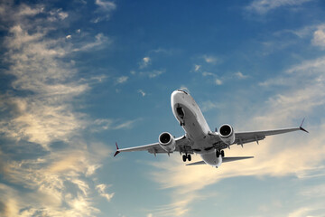 Wall Mural - Airplane flying in beautiful blue sky with clouds