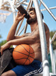 © peopleimages.com - Drinking, water bottle and man on court with basketball for training, match and practice outdoors. Sports, athlete and person with hydration, liquid and thirsty for exercise, workout and fitness