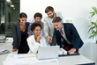 © peopleimages.com - Business people, meeting and pointing with laptop or blueprint for architectural planning or development at office. Group, architects or building designers with computer for corporate architecture