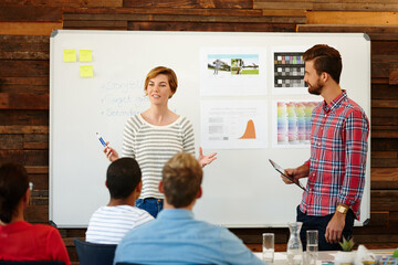 Fototapete - Woman, designer and talk with presentation in office for brainstorming, creative ideas and sport clothes. People, discussion and planning with sales growth, athlete target and information for project