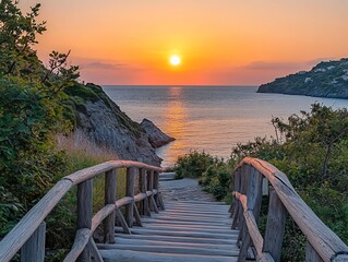 Aufkleber - Wooden steps lead down to a secluded beach at sunset over calm ocean water.