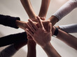 © peopleimages.com - People, hands and below with group for teamwork, social support or motivation in solidarity. Low angle, closeup or community piling with stack for collaboration, coordination or agreement together
