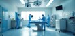 © miss irine - Blurred background of modern operating room with surgeons in blue suits. Scene captures sense of technology, cleanliness, sterility. Health professionals team working in hospital. Suitable for