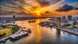 © Naowarat - Stunning Aerial View of Vibrant Cityscape at Sunset Over River