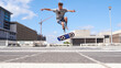 © peopleimages.com - Man, jump or flip stunt with skateboard in city for parkour challenge, extreme sport or cool skill. Male person, hipster or skating with board in air for control, balance or technique in urban town