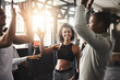 © peopleimages.com - High five, happy and people in gym for fitness, training and workout target, teamwork and goals. Sports, friends and men and women celebrate with gesture for exercise, health and performance in class