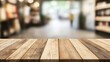 © Suryani - Blurred interior of a modern store with a wooden table in the foreground for product display